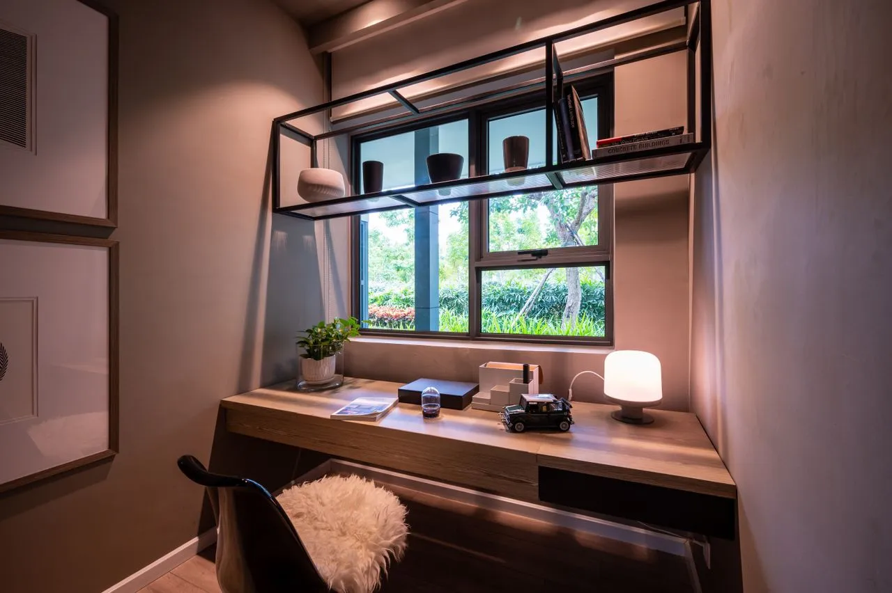 Timber desk and shelving framing a garden view