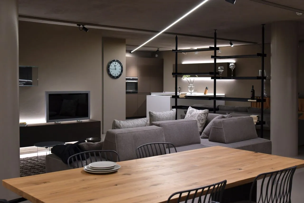 Dining table and open shelving within the living space