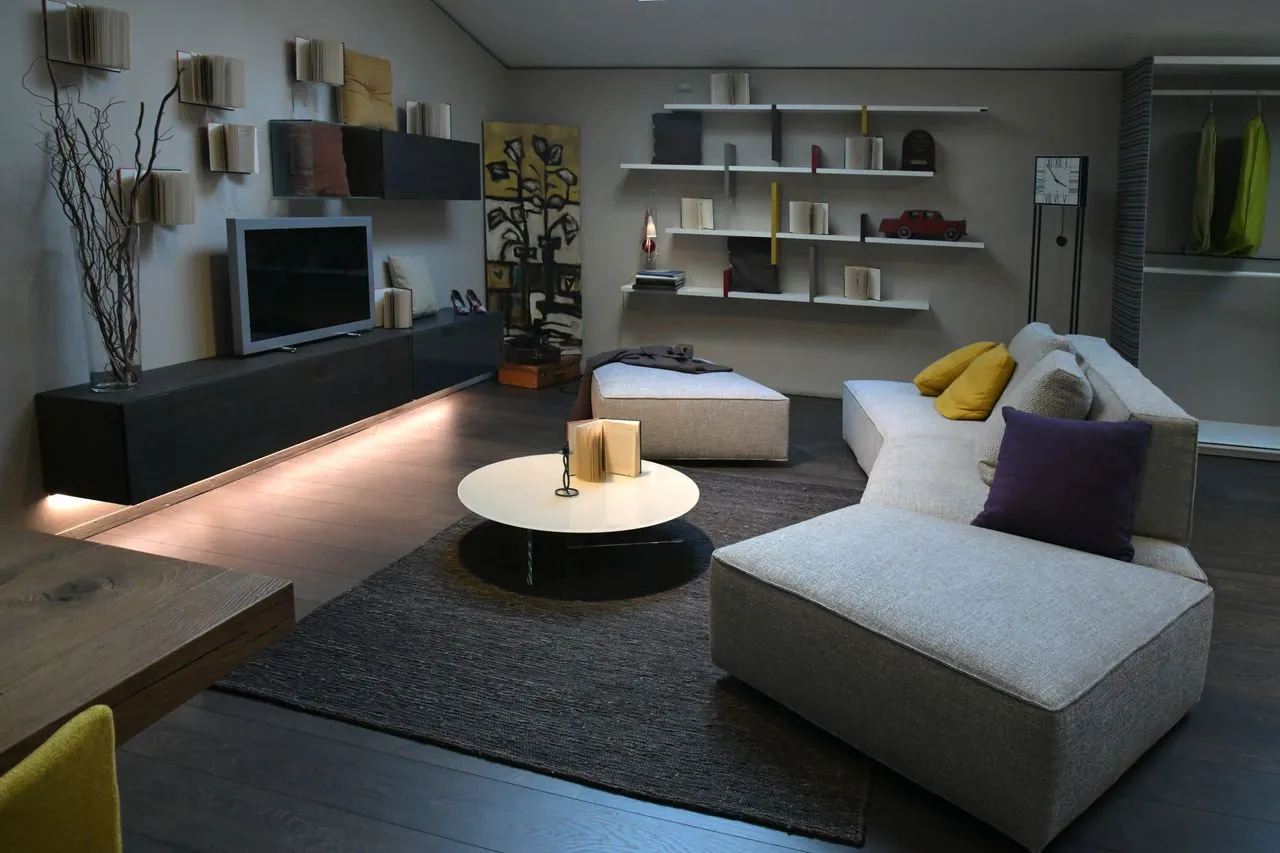 Evening sitting room with books and low lighting