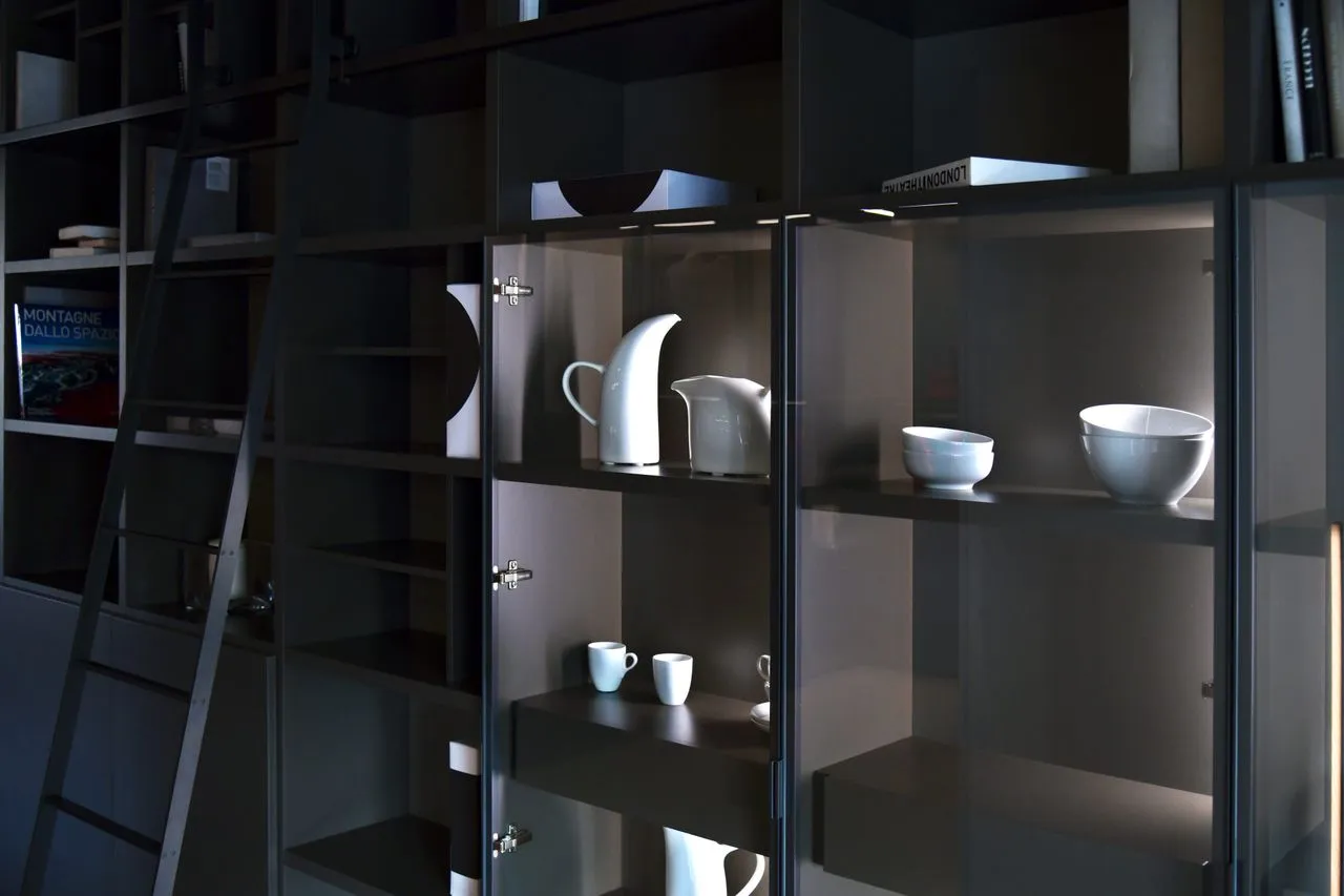 Hand-built lamp and dark display joinery
