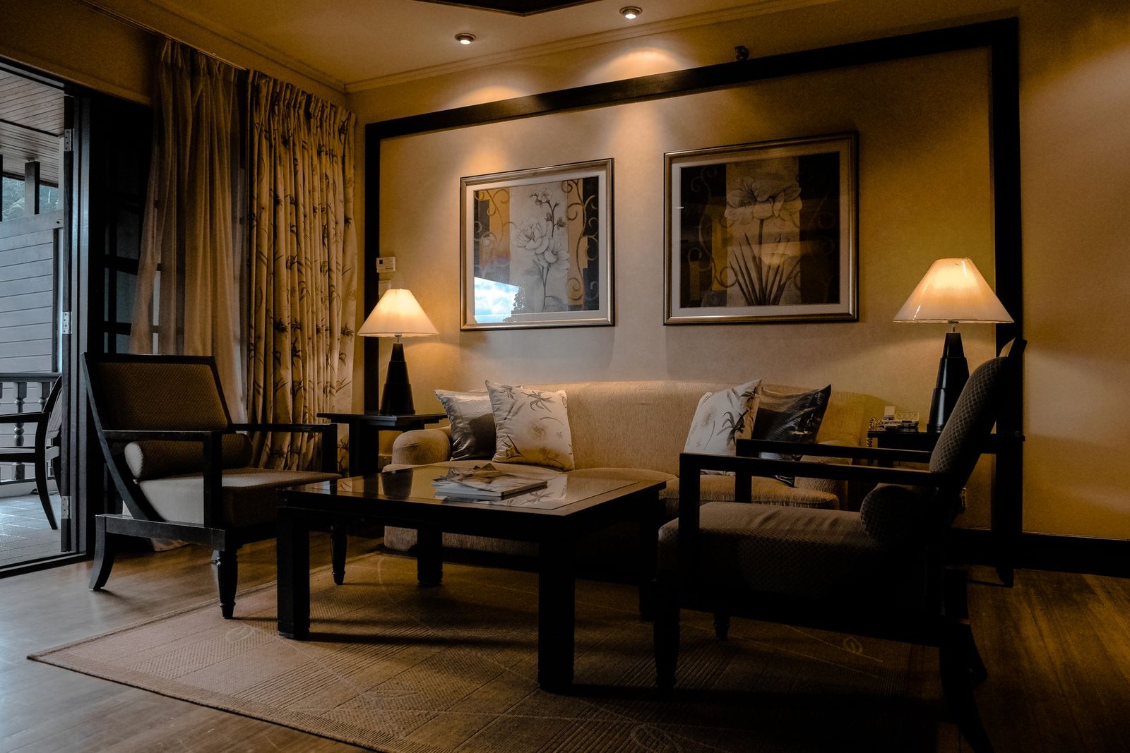 Night lounge arranged around pools of warm lamplight