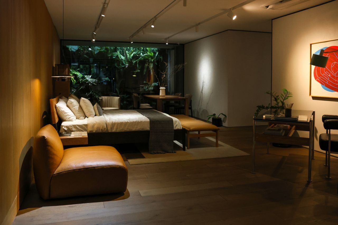 Private room with low furniture and garden beyond