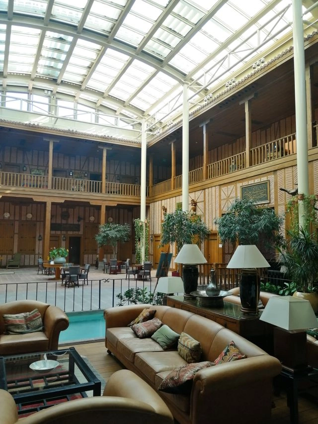 A double-height internal courtyard beside a sitting area