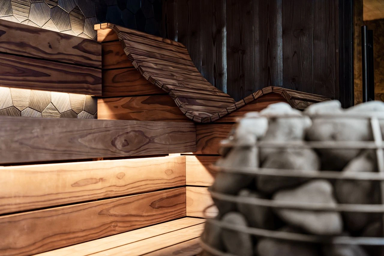Sculpted timber sauna bench detail