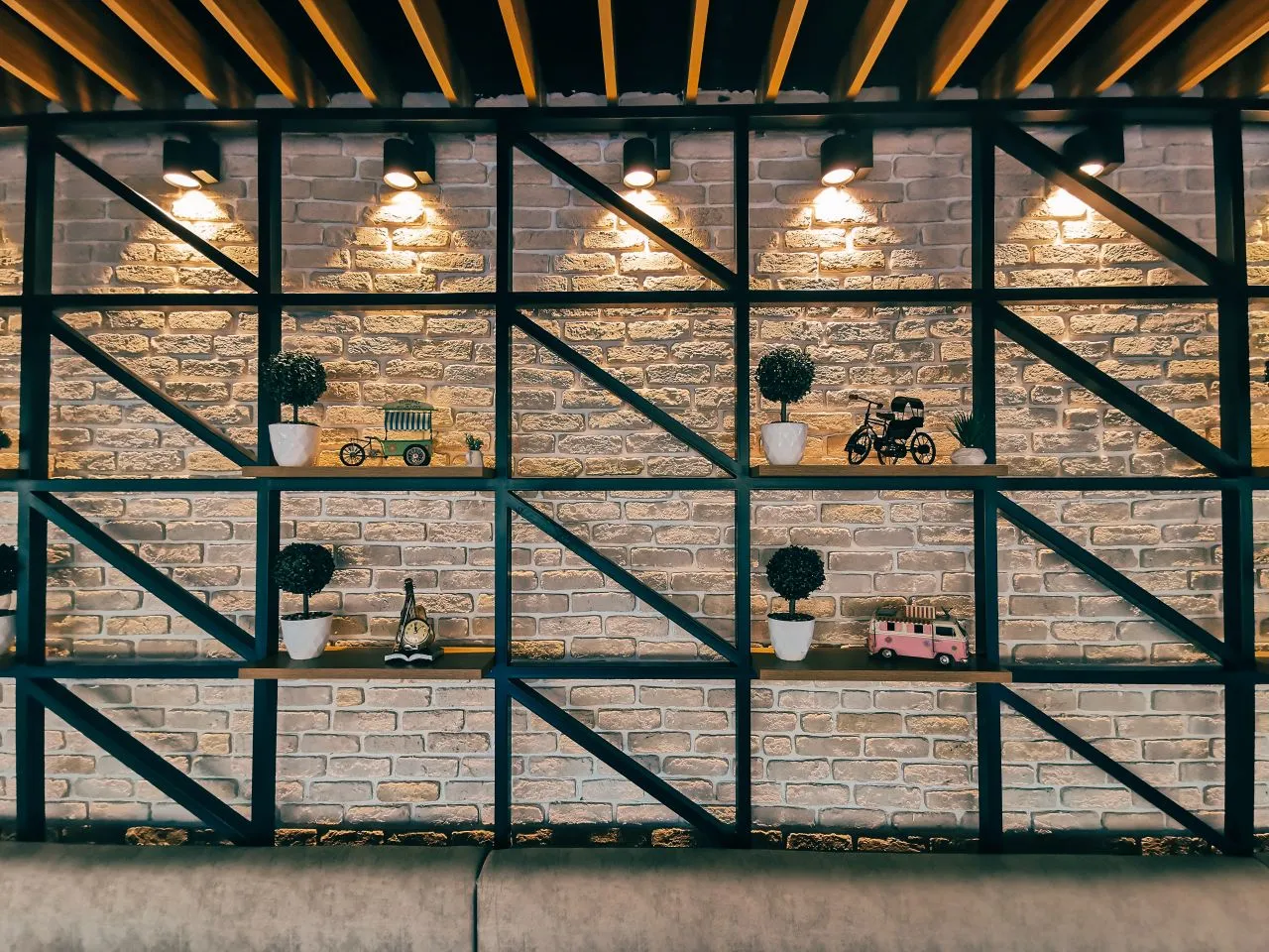 Objects displayed within a geometric open shelf