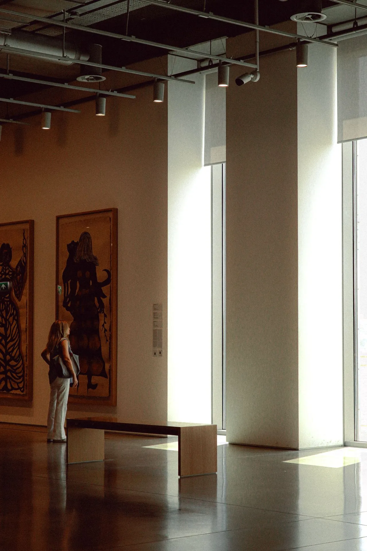 Artwork viewed between tall illuminated openings