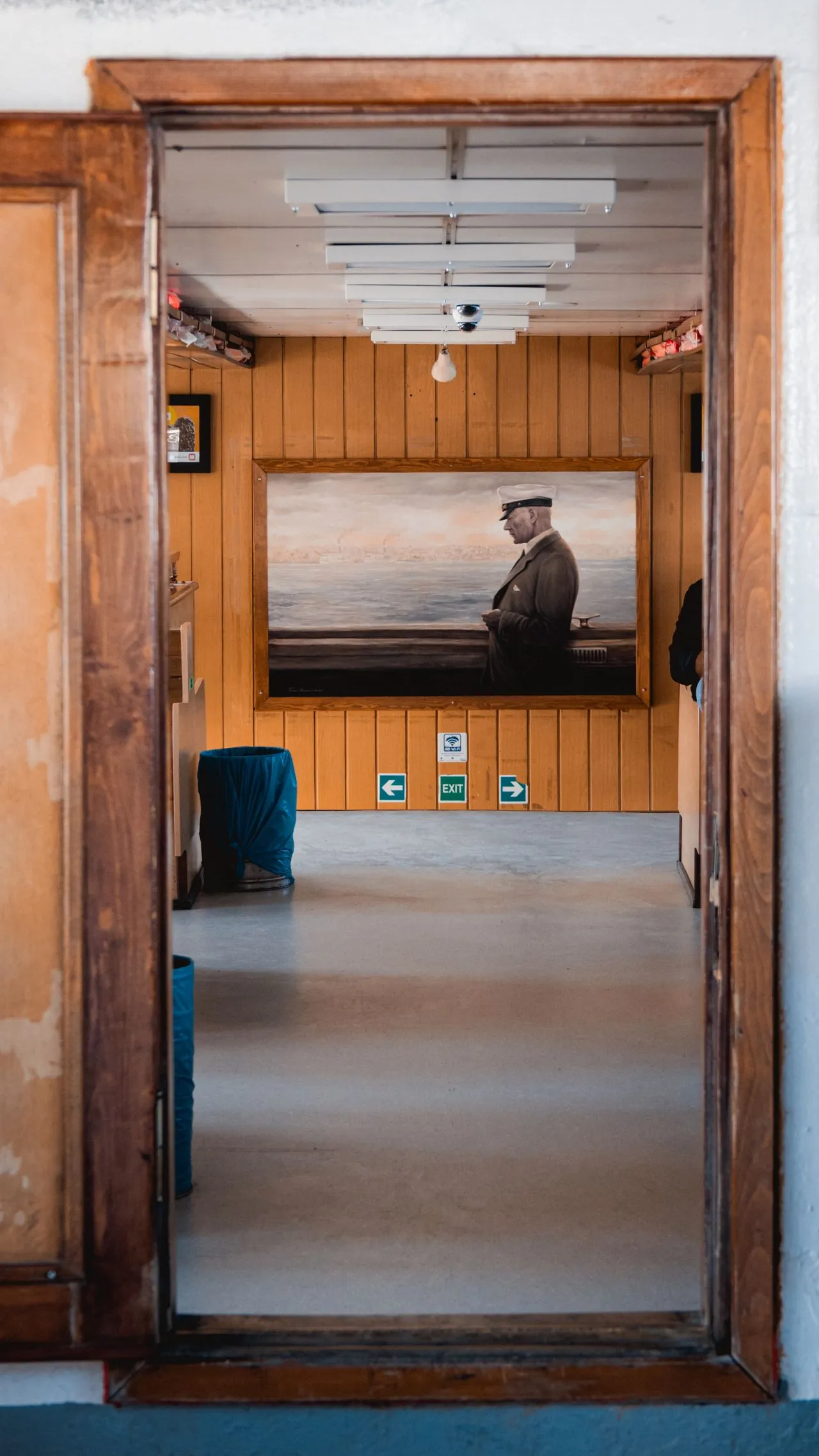 Artwork framed by a timber doorway