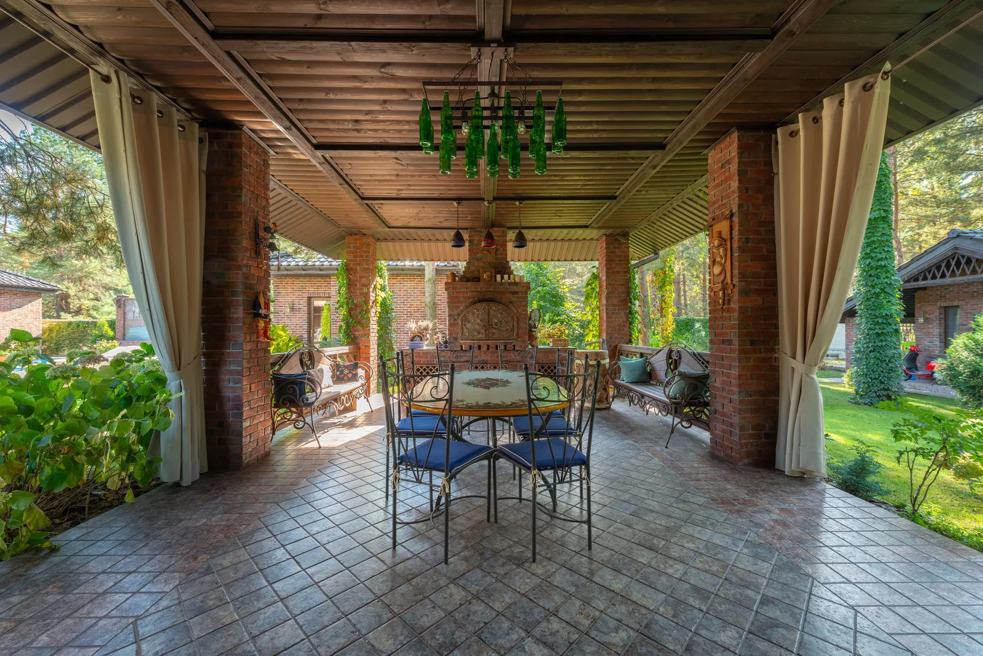 Covered garden terrace arranged for family dining